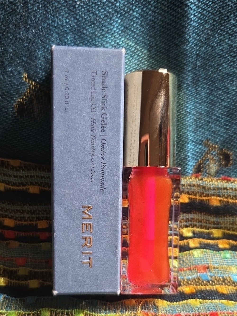 MERIT Shade Slick Gelée Tinted Lip Oil — Vibrant Orange-Pink Shine